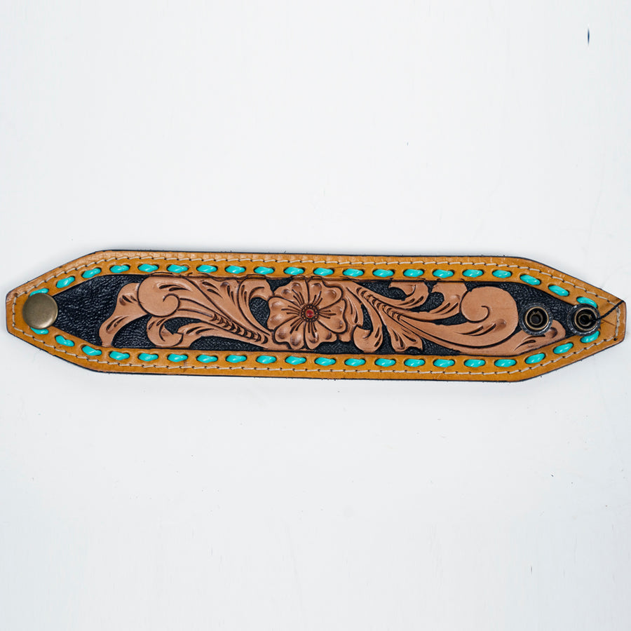 Leather wrist cuff with tooled floral design and turquoise studs - Uhorse