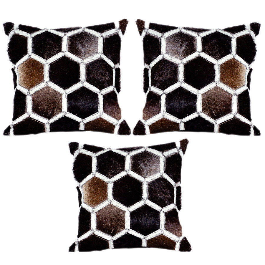 Cowhide patchwork pillow with hexagon pattern and white stitching - Uhorse