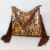 handcrafted western leather hobo bag with hair-on detailing and fringes by American Darling
