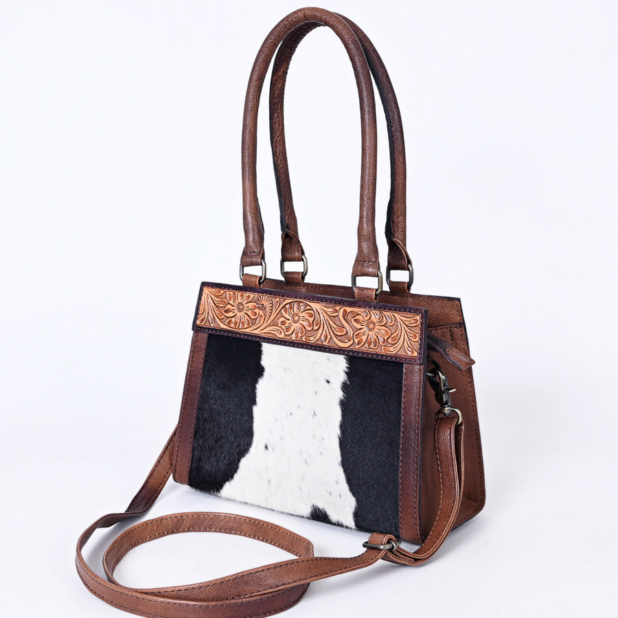 handcrafted western leather tote bag with hair-on cowhide and hand-tooled floral detailing