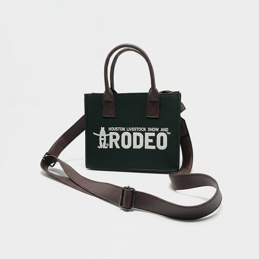 Dark green canvas tote bag with brown leather handles and Houston Livestock Show and Rodeo text - Uhorse